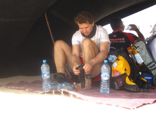 Changing socks at a Saharan checkpoint.