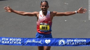 Meb Keflezighi of the US, crosses the finish line to win the Men's Elite division of the 118th Boston Marathon in Boston, Massachusetts April 21, 2014 .  AFP PHOTO / Timothy A. CLARY